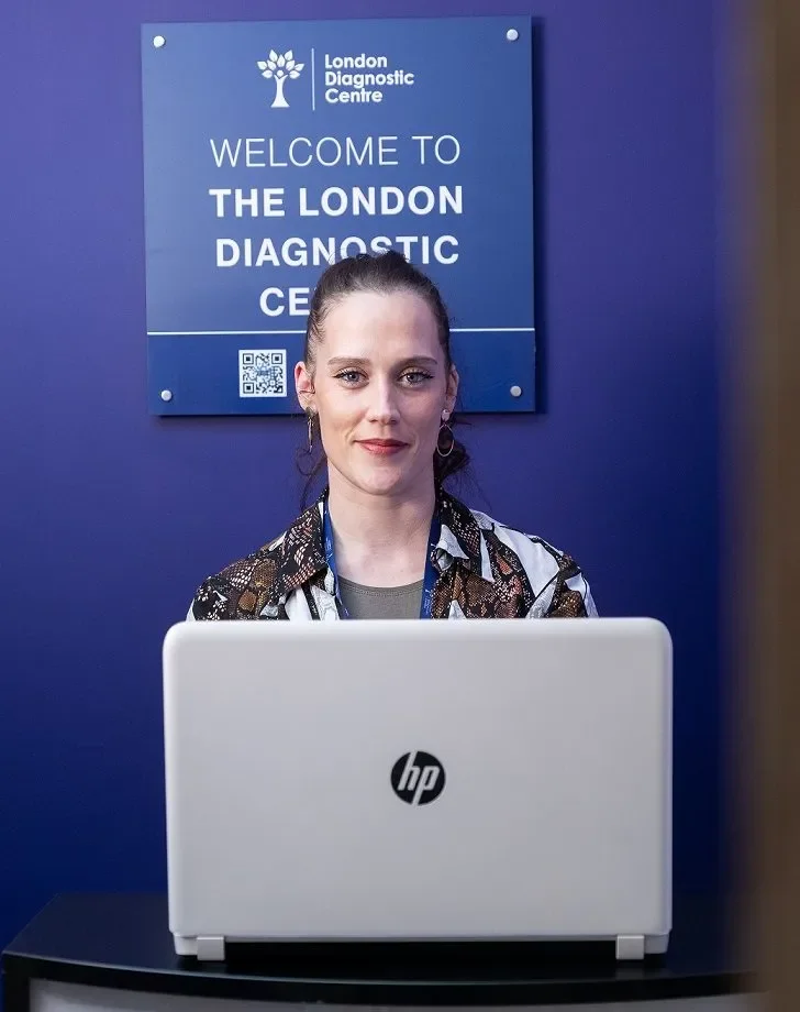 The reception desk at the London Diagnostic Centre, beneath the clinic's welcome sign