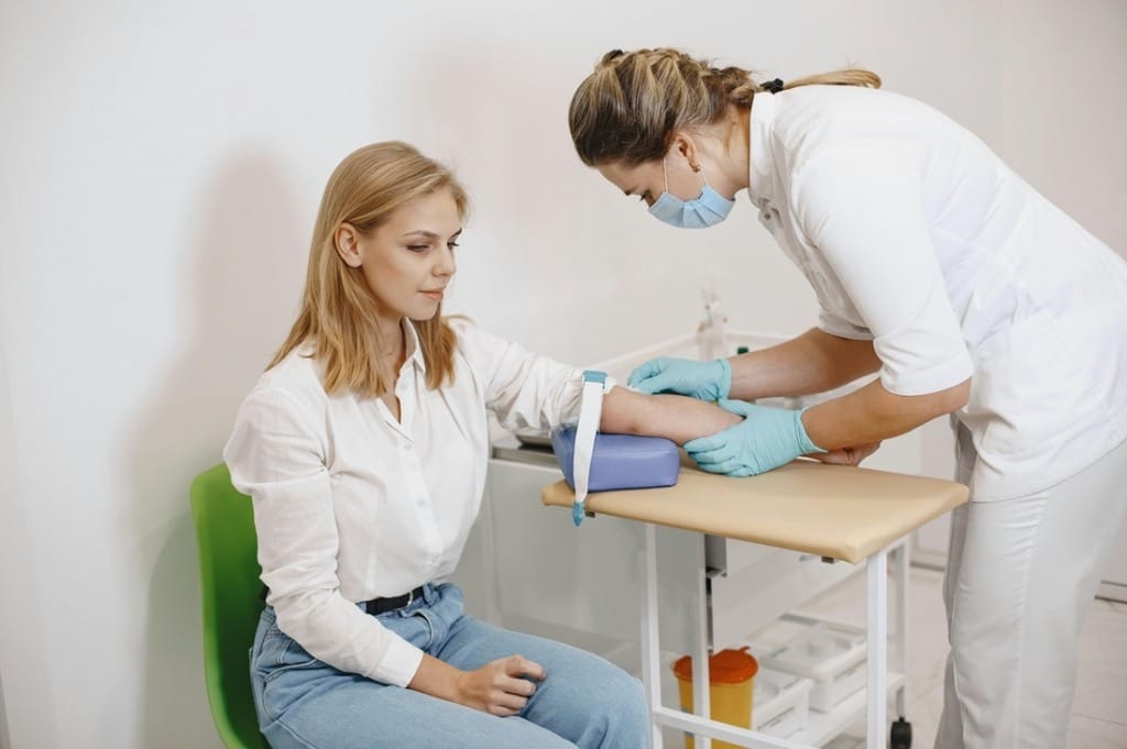 A nurse preparing a blood test