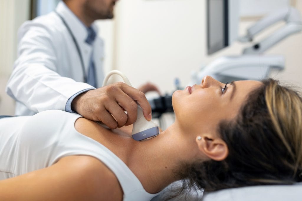 A sonographer carrying out an ultrasound examination